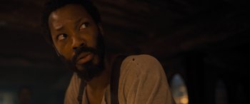 Movie still from “The Last Voyage of the Demeter” (2023), directed by André Øvredal – A person with a beard; Close Up shot, High angle