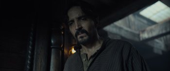 Movie still from “The Last Voyage of the Demeter” (2023), directed by André Øvredal – A person with a beard; Close Up shot, Low angle