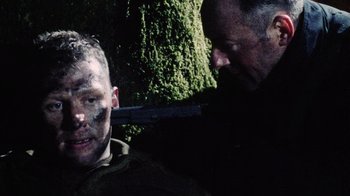 Movie still from “Dog Soldiers” (2002), directed by Neil Marshall – Close Up shot, Over the shoulder angle