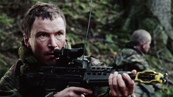 Movie still from “Dog Soldiers” (2002), directed by Neil Marshall – Medium shot, Low angle