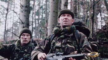 Movie still from “Dog Soldiers” (2002), directed by Neil Marshall – Medium shot, Low angle