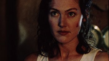 Movie still from “Dog Soldiers” (2002), directed by Neil Marshall – A person wearing a white shirt; Close Up shot, Low angle