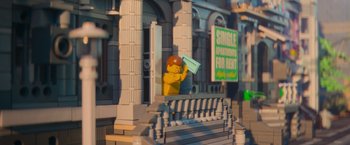 Movie still from “The Lego Movie” (2014), directed by Phil Lord – A lego man that is standing on the steps; Extreme Wide shot, High angle