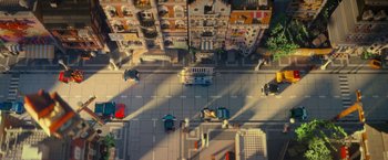 Movie still from “The Lego Movie” (2014), directed by Phil Lord – An aerial view of a city street with cars and buildings; Extreme Wide shot, High angle