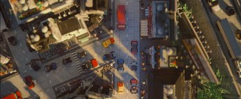 Movie still from “The Lego Movie” (2014), directed by Phil Lord – An aerial view of a busy city street with many cars; Extreme Wide shot, Overhead angle