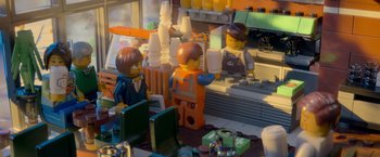 Movie still from “The Lego Movie” (2014), directed by Phil Lord – Two lego people are sitting at a table; Wide shot, Over the shoulder angle