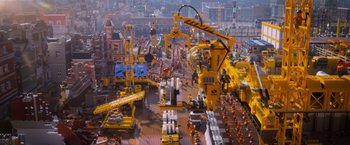 Movie still from “The Lego Movie” (2014), directed by Phil Lord – An aerial view of a construction site with a lot of machinery; Extreme Wide shot, High angle