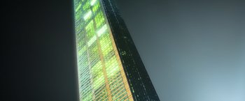 Movie still from “The Lego Movie” (2014), directed by Phil Lord – A tall building with a green light reflecting off it; Extreme Wide shot, Low angle