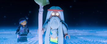 Movie still from “The Lego Movie” (2014), directed by Phil Lord – A playmobil figure holding a staff; Close Up shot, Low angle
