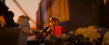 Movie still from “The Lego Movie” (2014), directed by Phil Lord – A lego man sitting on top of a pile of rocks; Extreme Close Up shot, Low angle