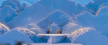 Movie still from “The Lego Movie” (2014), directed by Phil Lord – A group of people sitting on a platform in a room with clouds; Extreme Wide shot, Low angle
