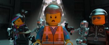 Movie still from “The Lego Movie” (2014), directed by Phil Lord – A lego minifig wearing an orange vest; Close Up shot, Low angle