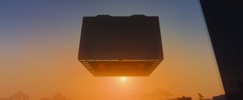 Movie still from “The Lego Movie” (2014), directed by Phil Lord – The sun is setting in the sky above a box; Extreme Wide shot, Low angle