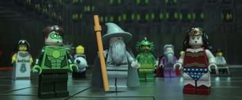 Movie still from “The Lego Movie” (2014), directed by Phil Lord – A lego figure of gandalf the white with a staff; Wide shot, Low angle