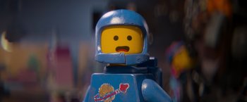 Movie still from “The Lego Movie” (2014), directed by Phil Lord – A lego figure wearing a space suit; Close Up shot, Overhead angle
