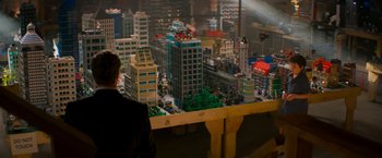 Movie still from “The Lego Movie” (2014), directed by Phil Lord – A man looking at a model city; Extreme Wide shot, Over the shoulder angle