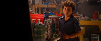 Movie still from “The Lego Movie” (2014), directed by Phil Lord – A young boy standing in front of a toy city; Close Up shot, Over the shoulder angle