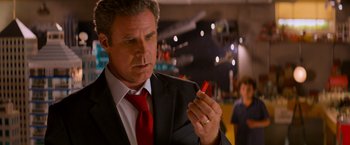 Movie still from “The Lego Movie” (2014), directed by Phil Lord – A person wearing a suit and tie; Close Up shot, Over the shoulder angle