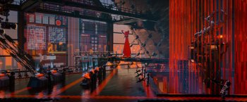 Movie still from “The Lego Movie” (2014), directed by Phil Lord – A red statue of a woman in a red dress stands in front of a building; Extreme Wide shot, Low angle