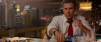 Movie still from “The Lego Movie” (2014), directed by Phil Lord – A man in white shirt and red tie working on a project; Medium shot, Over the shoulder angle