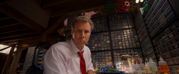 Movie still from “The Lego Movie” (2014), directed by Phil Lord – A man wearing a white shirt and a red neck tie; Close Up shot, Low angle