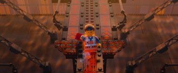 Movie still from “The Lego Movie” (2014), directed by Phil Lord – An image of a lego man on a bridge; Wide shot, Overhead angle