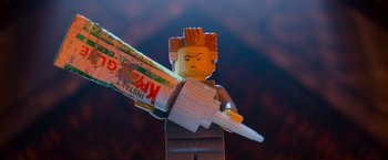 Movie still from “The Lego Movie” (2014), directed by Phil Lord – A lego man holding a tube of toothpaste in his hand; Extreme Close Up shot, Low angle