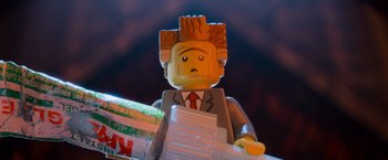 Movie still from “The Lego Movie” (2014), directed by Phil Lord – A man that is sitting at a table; Extreme Close Up shot, Low angle