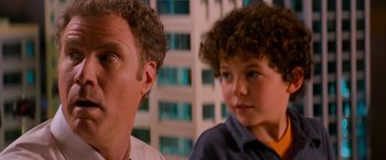 Movie still from “The Lego Movie” (2014), directed by Phil Lord – A man and a boy sitting next to each other in front of a building; Close Up shot, Over the shoulder angle