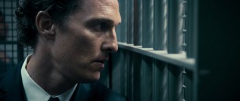 Movie still from “The Lincoln Lawyer” (2011), directed by Brad Furman – A person looking out a window; Close Up shot, Low angle