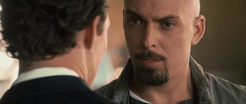 Movie still from “The Lincoln Lawyer” (2011), directed by Brad Furman – A person with a beard looking at another person; Close Up shot, Over the shoulder angle