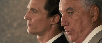 Movie still from “The Lincoln Lawyer” (2011), directed by Brad Furman – Two men in business suits looking at the camera; Close Up shot, Low angle