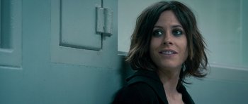 Movie still from “The Lincoln Lawyer” (2011), directed by Brad Furman – A person leaning against a wall; Close Up shot, Over the shoulder angle