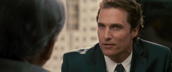 Movie still from “The Lincoln Lawyer” (2011), directed by Brad Furman – A person wearing a suit and tie; Close Up shot, Over the shoulder angle