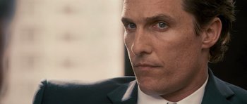 Movie still from “The Lincoln Lawyer” (2011), directed by Brad Furman – A man in a suit and tie; Close Up shot, Over the shoulder angle