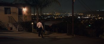 Movie still from “The Lincoln Lawyer” (2011), directed by Brad Furman – A man walking down a street at night; Extreme Wide shot, Over the shoulder angle