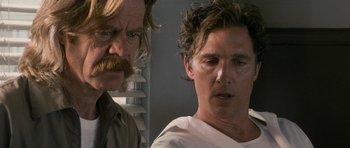 Movie still from “The Lincoln Lawyer” (2011), directed by Brad Furman – Two men standing next to each other in front of a window; Close Up shot, Over the shoulder angle