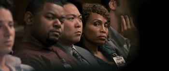 Movie still from “The Lincoln Lawyer” (2011), directed by Brad Furman – A group of men and women sitting in front of a camera; Close Up shot, Over the shoulder angle
