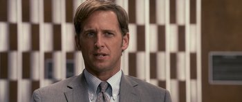 Movie still from “The Lincoln Lawyer” (2011), directed by Brad Furman – A person wearing a suit and tie; Close Up shot, Over the shoulder angle