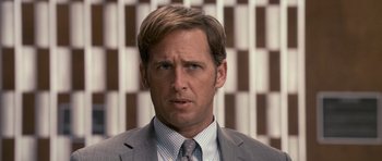 Movie still from “The Lincoln Lawyer” (2011), directed by Brad Furman – A person wearing a suit and tie; Close Up shot, Over the shoulder angle