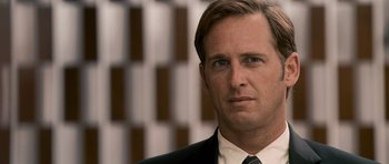 Movie still from “The Lincoln Lawyer” (2011), directed by Brad Furman – A person wearing a suit and tie; Close Up shot, Over the shoulder angle