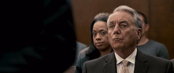 Movie still from “The Lincoln Lawyer” (2011), directed by Brad Furman – A man and a woman in a suit and tie; Close Up shot, Over the shoulder angle