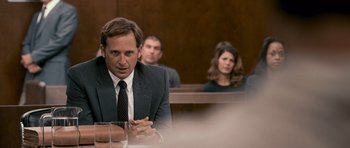 Movie still from “The Lincoln Lawyer” (2011), directed by Brad Furman – A man and two women sitting in a court room; Medium shot, Over the shoulder angle