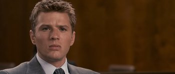 Movie still from “The Lincoln Lawyer” (2011), directed by Brad Furman – A person wearing a suit and tie; Close Up shot, Over the shoulder angle