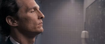Movie still from “The Lincoln Lawyer” (2011), directed by Brad Furman – A man's face in a dark room; Close Up shot, Over the shoulder angle