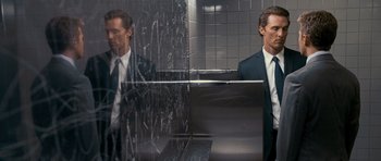 Movie still from “The Lincoln Lawyer” (2011), directed by Brad Furman – A man standing in front of a mirror in a bathroom; Medium shot, Low angle