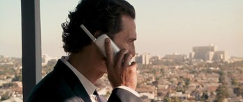 Movie still from “The Lincoln Lawyer” (2011), directed by Brad Furman – A person talking on a cell phone; Close Up shot, Over the shoulder angle