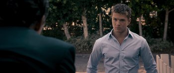 Movie still from “The Lincoln Lawyer” (2011), directed by Brad Furman – A young man in a dress shirt and suit jacket; Close Up shot, Over the shoulder angle