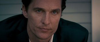 Movie still from “The Lincoln Lawyer” (2011), directed by Brad Furman – A person wearing a suit and tie; Close Up shot, Low angle