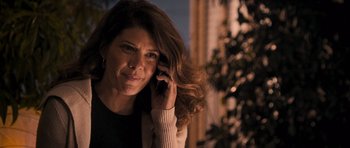 Movie still from “The Lincoln Lawyer” (2011), directed by Brad Furman – A woman is talking on a cell phone; Close Up shot, Over the shoulder angle